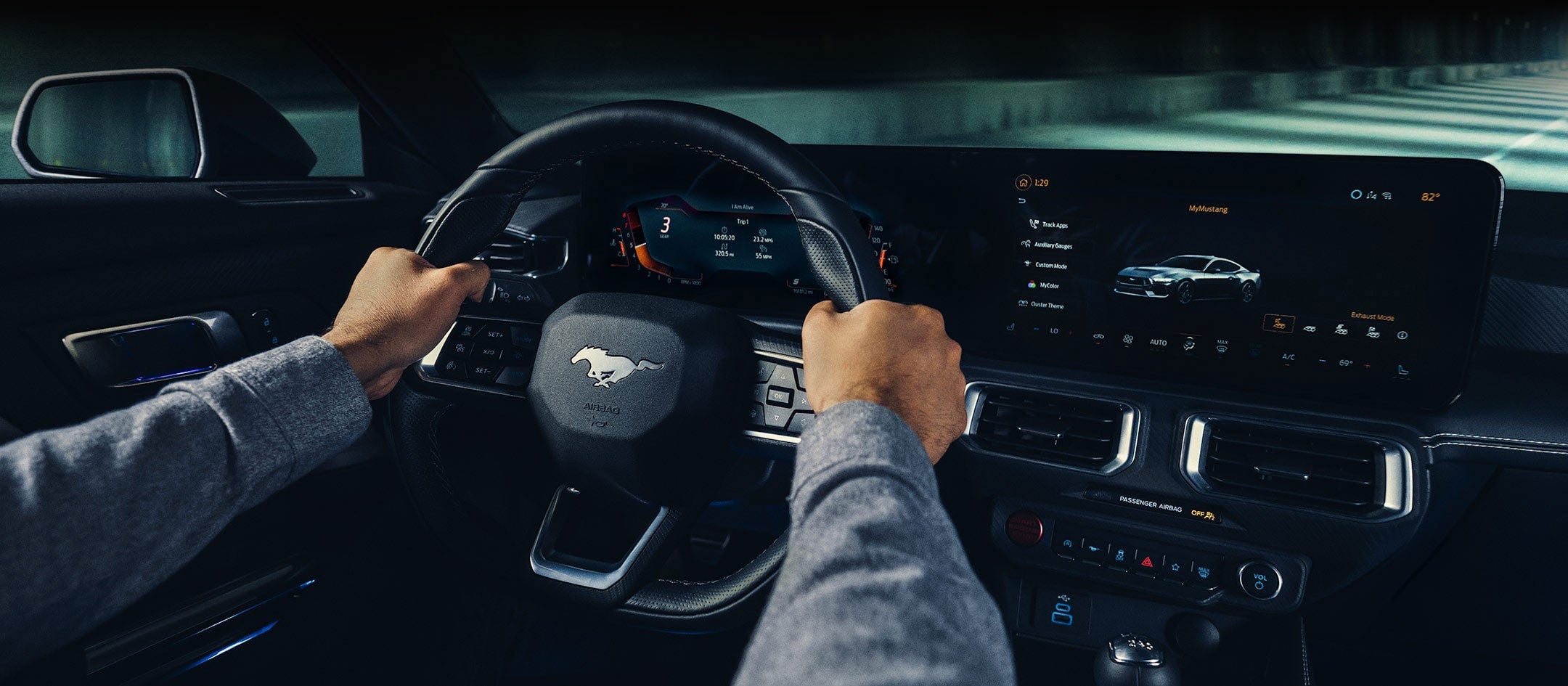 A 2024 Ford Mustang® model interior with a person driving | Mike Reichenbach Ford in Florence SC