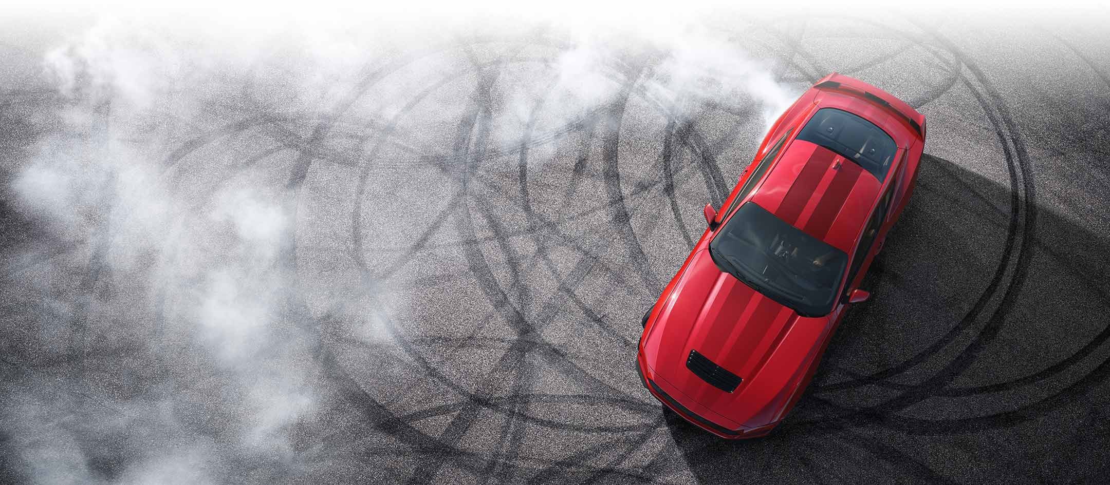 Overhead view of a 2025 Ford Mustang® model with tire tracks on pavement | Mike Reichenbach Ford in Florence SC