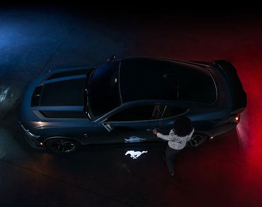 2025 Ford Mustang® Dark Horse™ model with a driver approaching the vehicle | Mike Reichenbach Ford in Florence SC