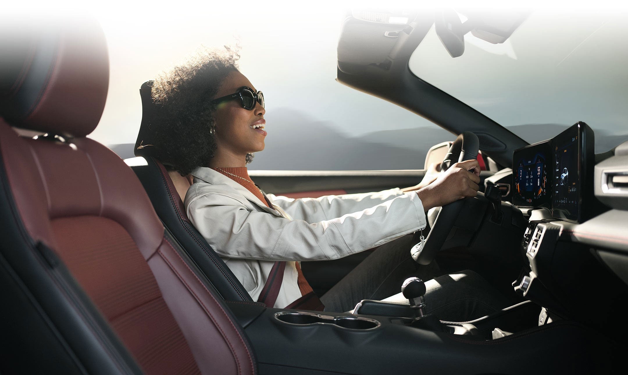 Person sitting in the driver’s seat of a 2025 Ford Mustang® convertible | Mike Reichenbach Ford in Florence SC