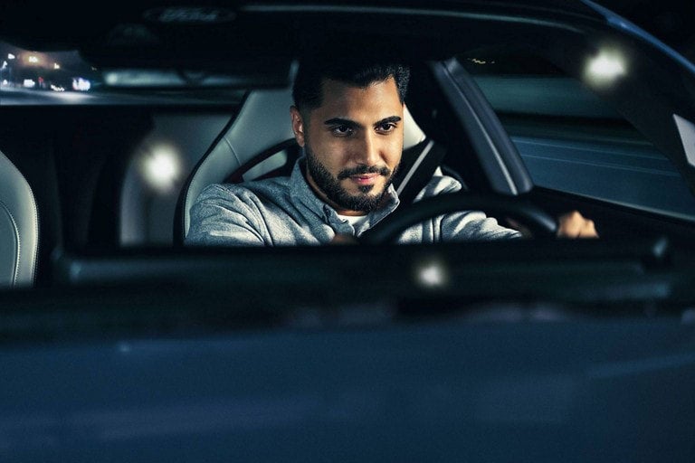 Person sitting in the driver’s seat of a parked 2025 Ford Mustang® coupe | Mike Reichenbach Ford in Florence SC