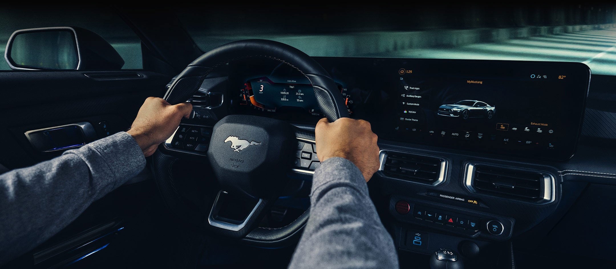 A 2025 Ford Mustang® model interior with a person driving | Mike Reichenbach Ford in Florence SC