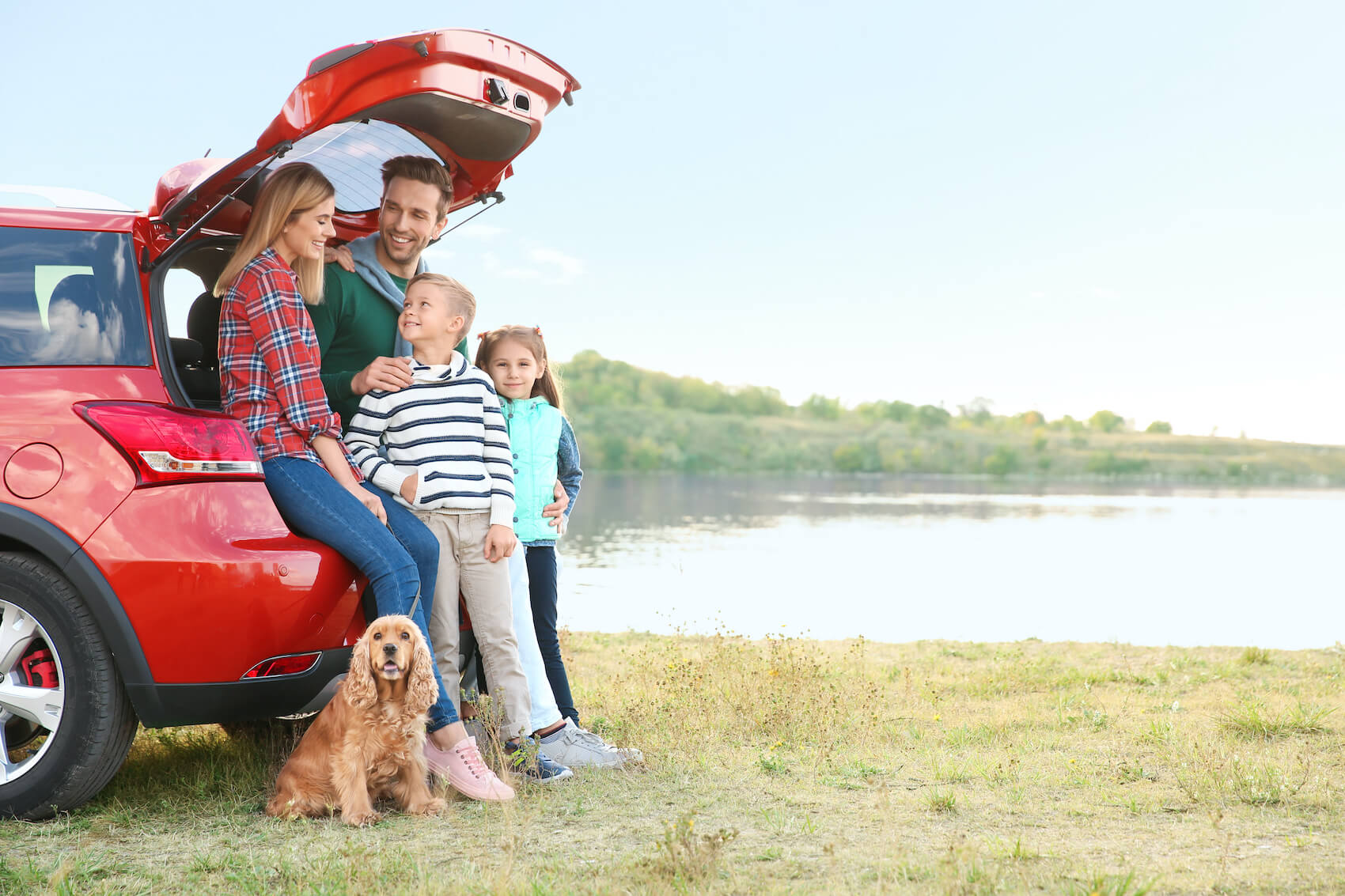 Family Sitting in the Trunk of a Car